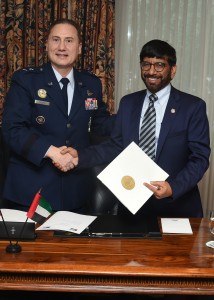 Major General Clinton E. Crosier, U.S. Air Force, Director of Plans and Policy at U.S. Strategic Command, and His Excellency Dr. Khalifa Al Romaithi, Chairman of the UAE Space Agency, shake hands after signing an MoU committing both sides to sharing space situational awareness data. Photograph by Senior Airman William Branch, courtesy of the U.S. Air Force.