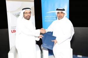 H.E. Dr. Ali Rashid Al Noaimi, Vice Chancellor of UAEU, and H.E. Hamad Obaid Al Mansoori, Chairman of the Board of Directors at MBRSC, shake hands. Photograph courtesy of the Mohammed bin Rashid Space Centre.
