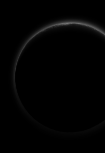 The Dark Side of Pluto: NASA’s New Horizons spacecraft took this stunning image of Pluto only a few minutes after closest approach on July 14, 2015. The image was obtained at a high phase angle –that is, with the sun on the other side of Pluto, as viewed by New Horizons. Seen here, sunlight filters through and illuminates Pluto’s complex atmospheric haze layers. Photograph courtesy of NASA.