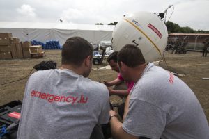 Aid workers installing a satellite communications terminal in Kathmandu, Nepal. Photograph courtesy of SES.